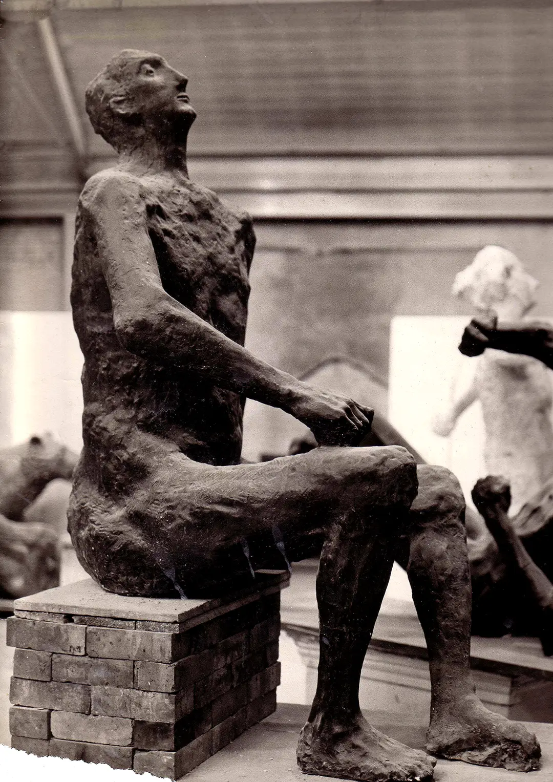 Seated male figure