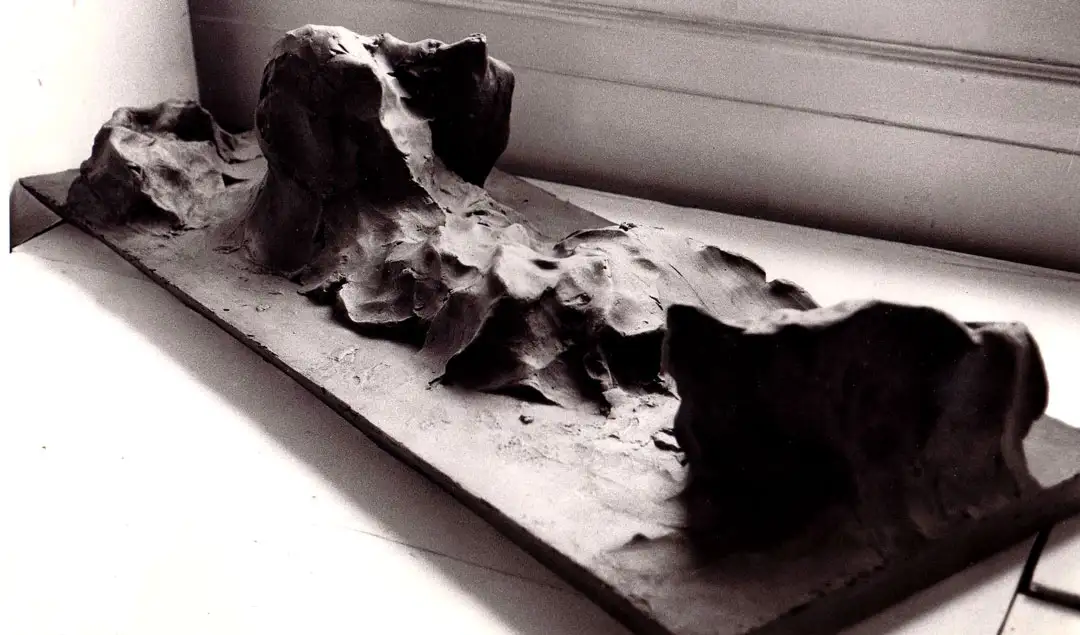 Reclining figure in bronze