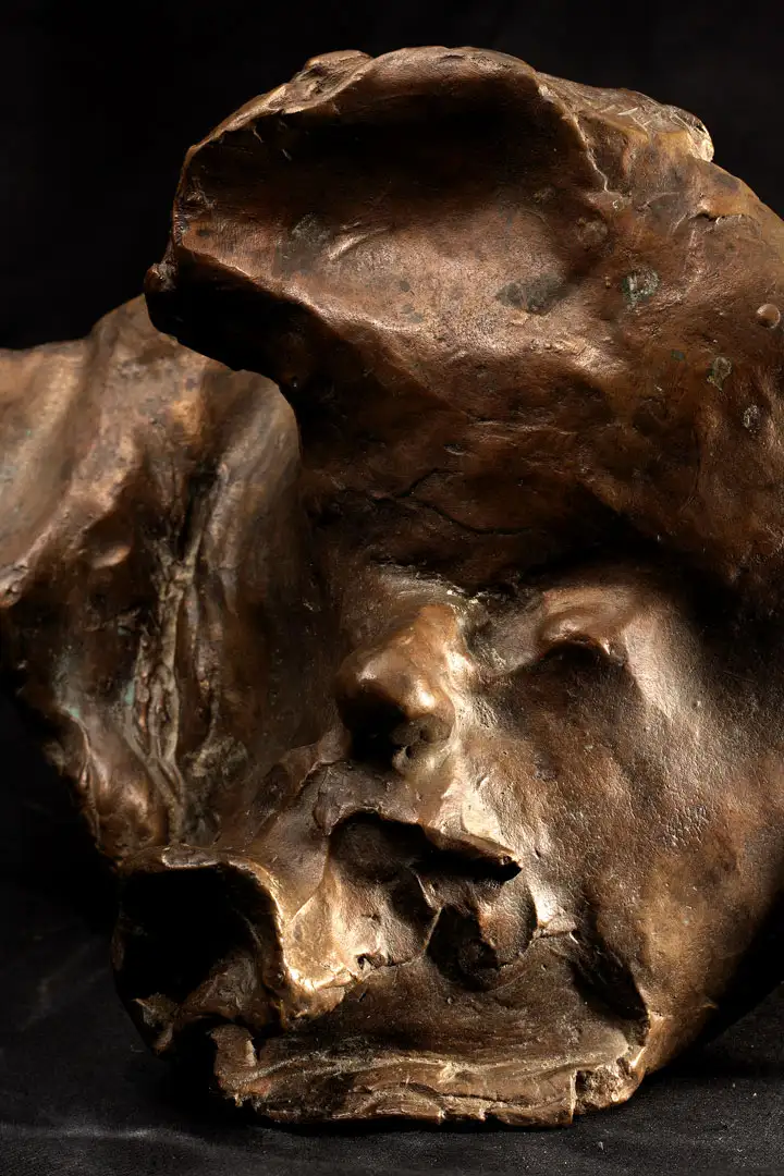 A bronze portrait of Kirk Huffman