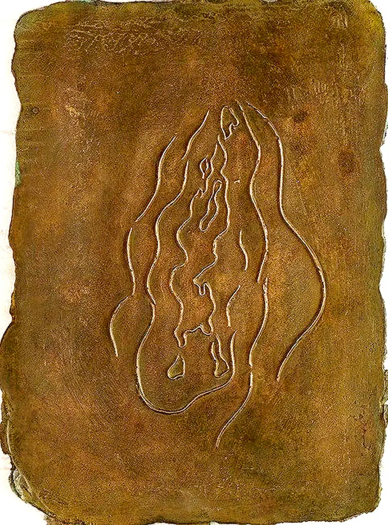 A relief of a swimmer cast in bronze