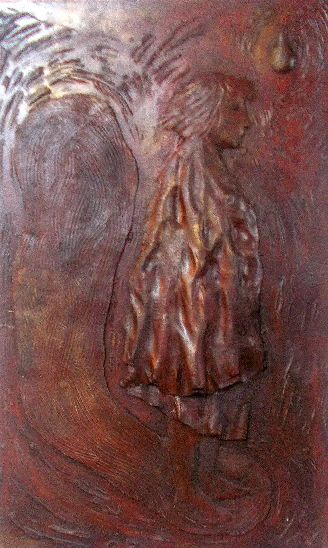 A standing figure cast in red resin