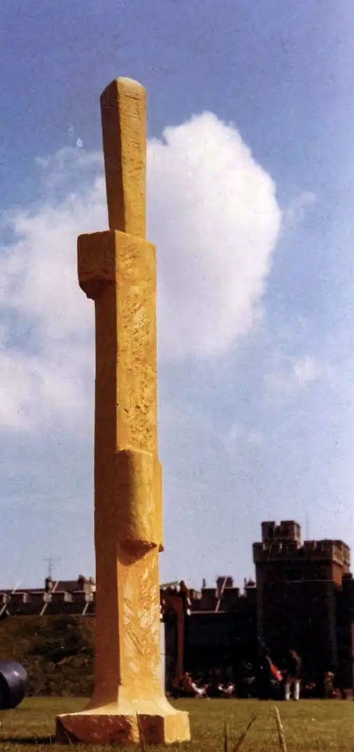 A vibrant colour photograph of an orange figurative sculpture at the 1968 open air exhibition at Cardiff Castle