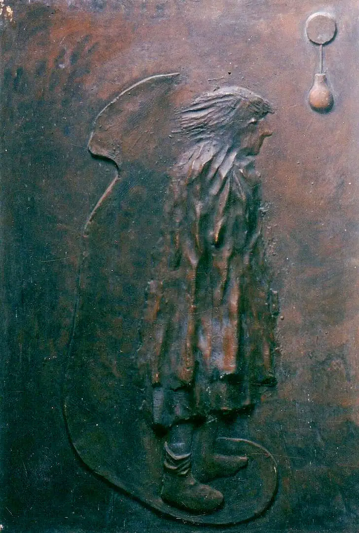 A standing figure cast in red resin