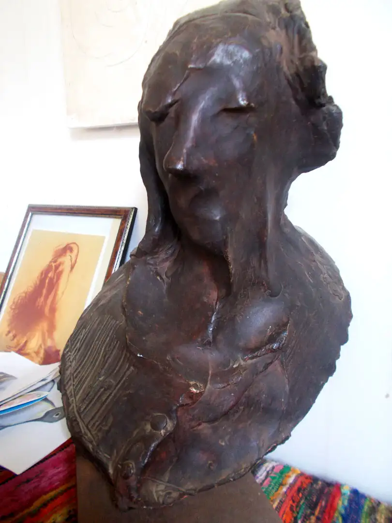 A plaster sculpture of a head to be used to create a bronze casting