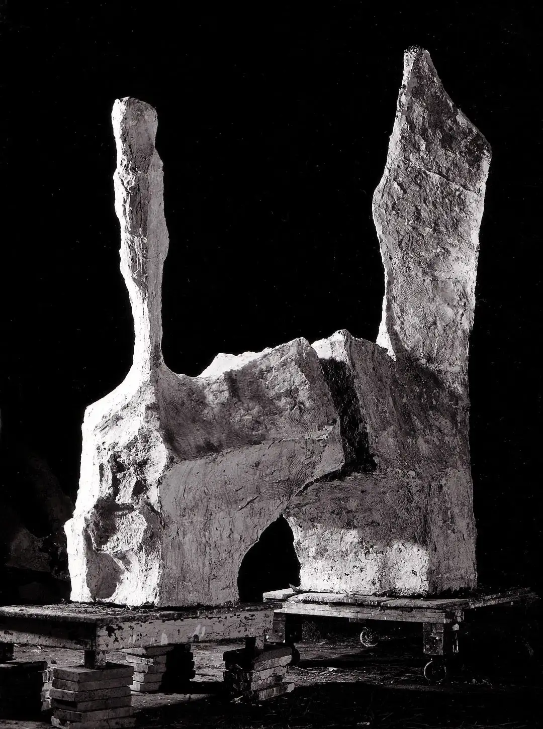 Divided Figures sculpture shot in black and white on a black background