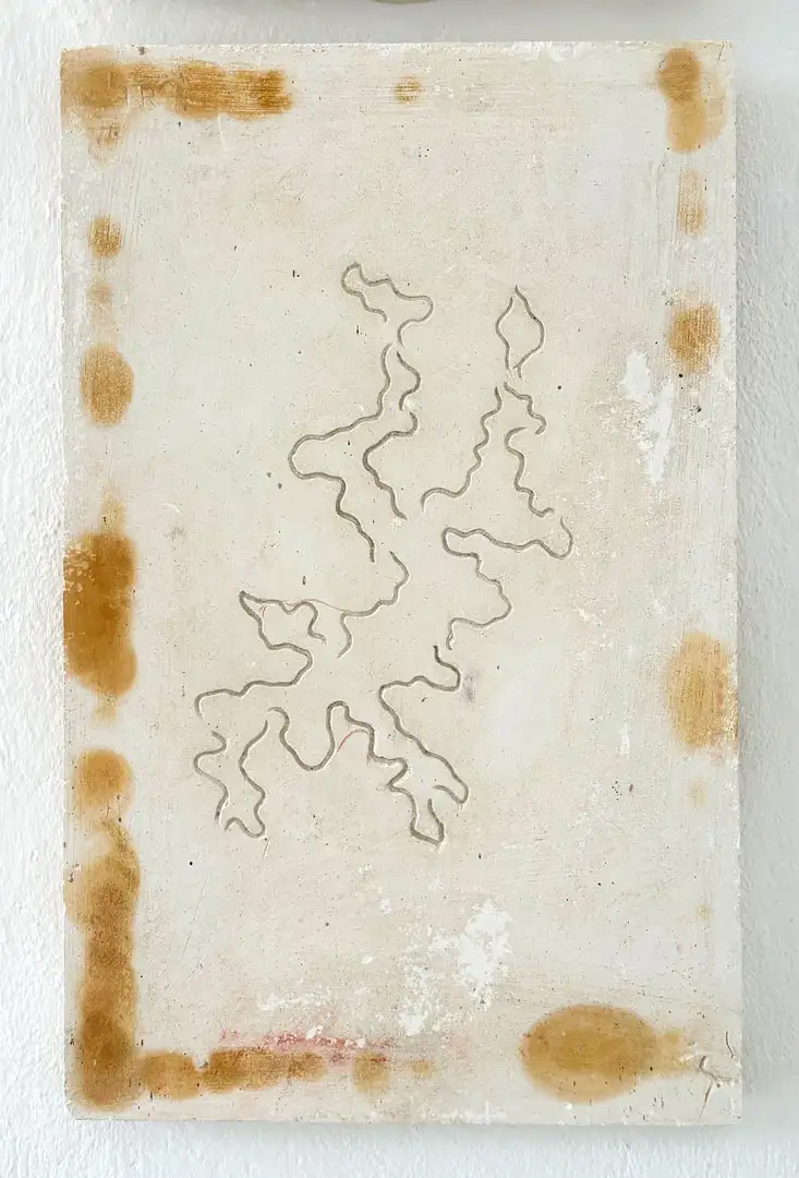 A relief of a swimmer in plaster